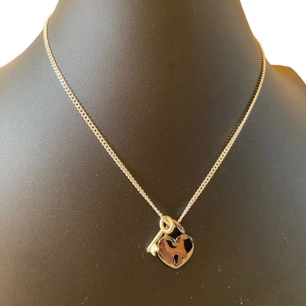 Gun Metal Heart Shaped Lock w/ Gold Tone Key on Serpentine Chain.